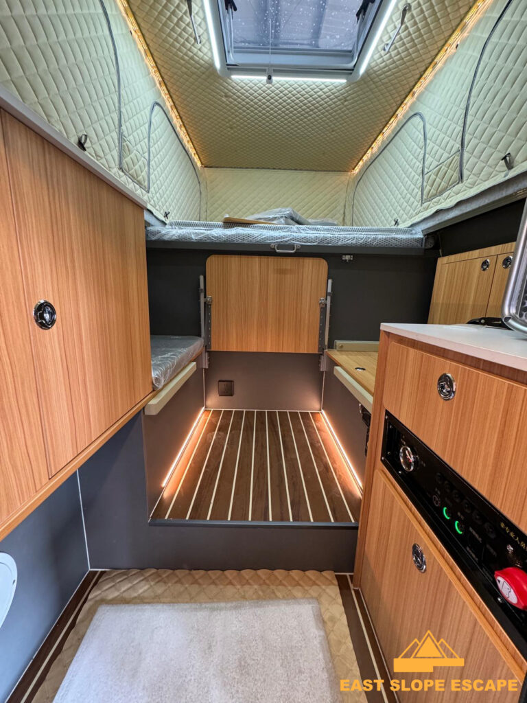 Interior view of camper, sunroof visible