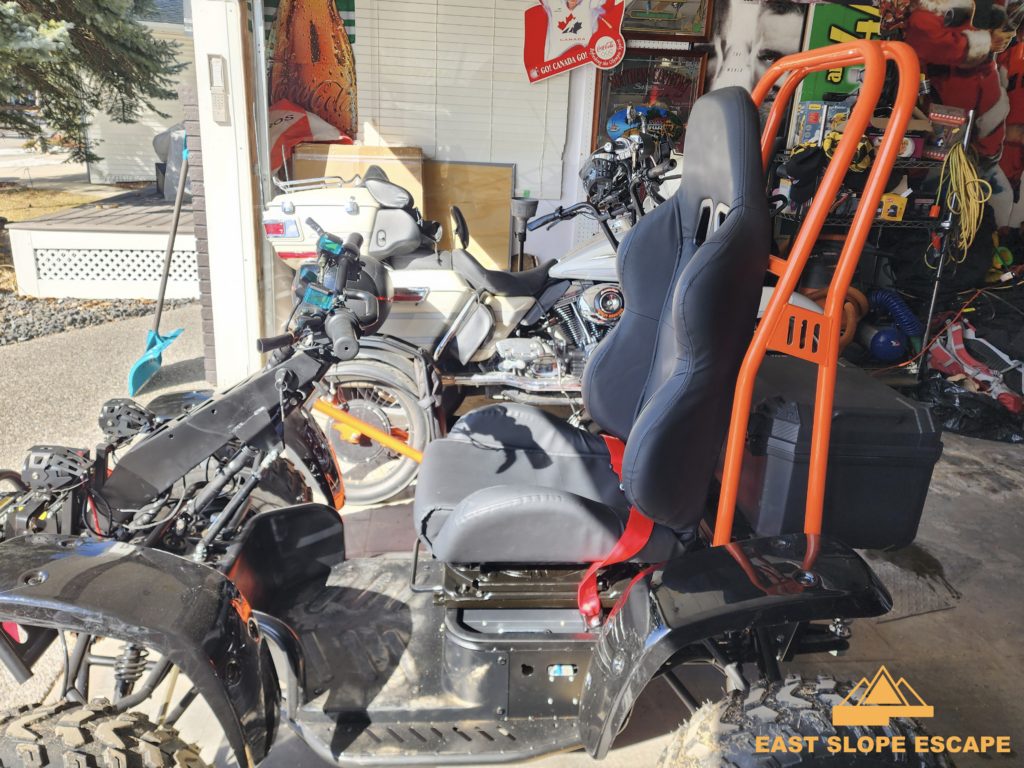 A side view of an ATV in a garage
